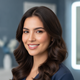Smiling Latin American woman with smooth, shiny hair, looking confidently at the camera, against a soft blue and white backgr